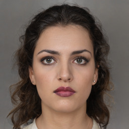 Neutral white young-adult female with medium  brown hair and brown eyes