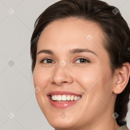 Joyful white young-adult female with medium  brown hair and brown eyes