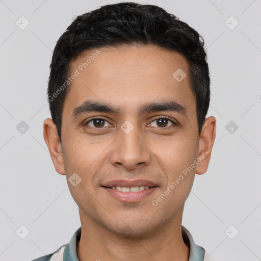 Joyful white young-adult male with short  black hair and brown eyes