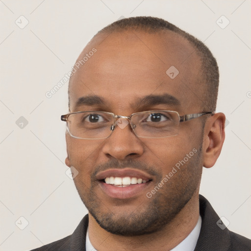 Joyful black young-adult male with short  brown hair and brown eyes