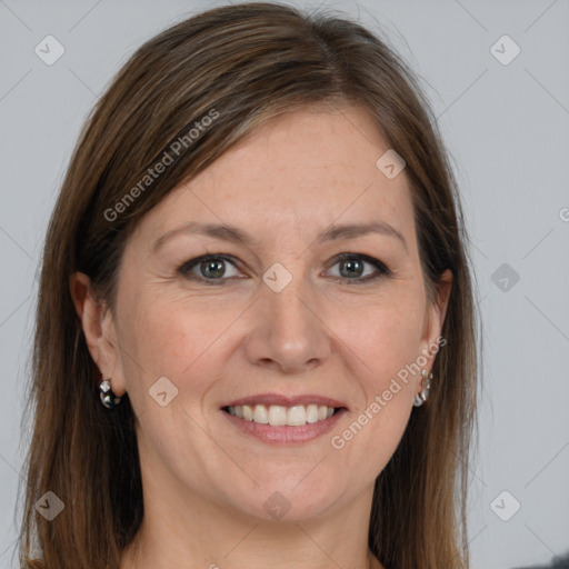 Joyful white adult female with long  brown hair and grey eyes