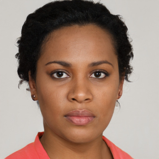 Neutral black young-adult female with short  black hair and brown eyes