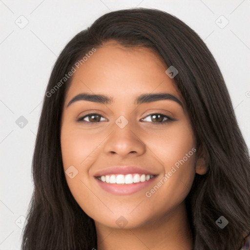 Joyful latino young-adult female with long  brown hair and brown eyes