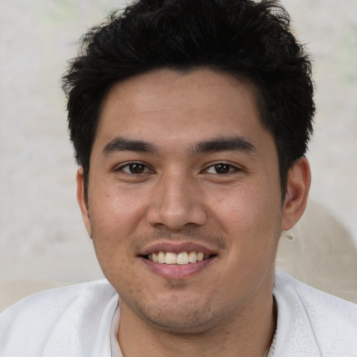 Joyful asian young-adult male with short  brown hair and brown eyes