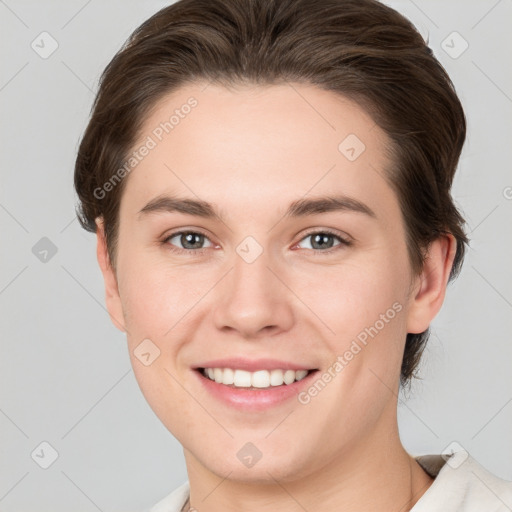 Joyful white young-adult female with short  brown hair and grey eyes