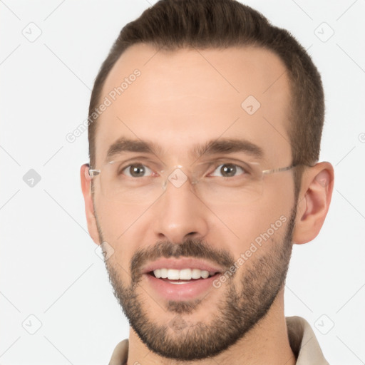 Joyful white young-adult male with short  brown hair and brown eyes