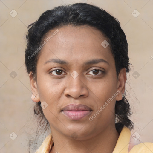 Joyful latino young-adult female with short  brown hair and brown eyes
