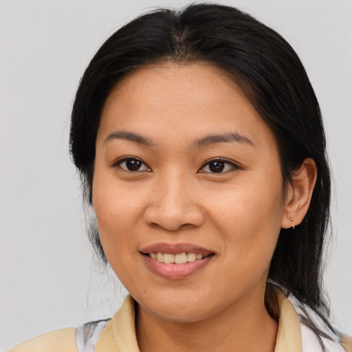 Joyful asian young-adult female with medium  brown hair and brown eyes