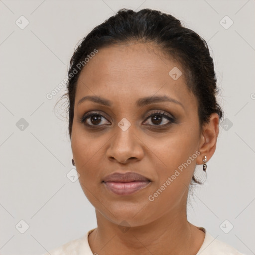 Joyful latino young-adult female with short  brown hair and brown eyes