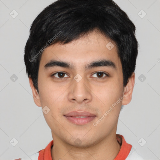 Joyful asian young-adult male with short  black hair and brown eyes