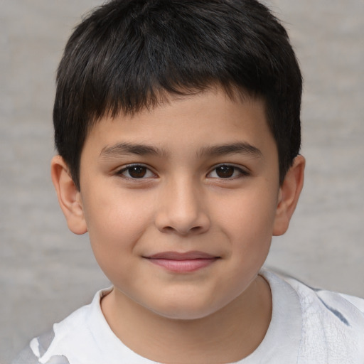 Joyful white child male with short  brown hair and brown eyes