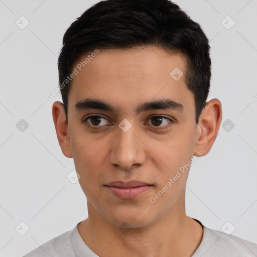 Joyful latino young-adult male with short  black hair and brown eyes