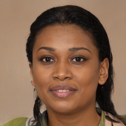 Joyful black young-adult female with medium  black hair and brown eyes