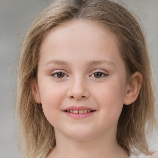 Joyful white child female with medium  brown hair and grey eyes