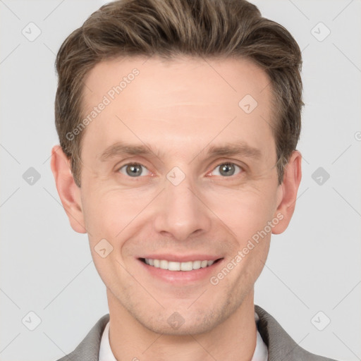 Joyful white adult male with short  brown hair and grey eyes