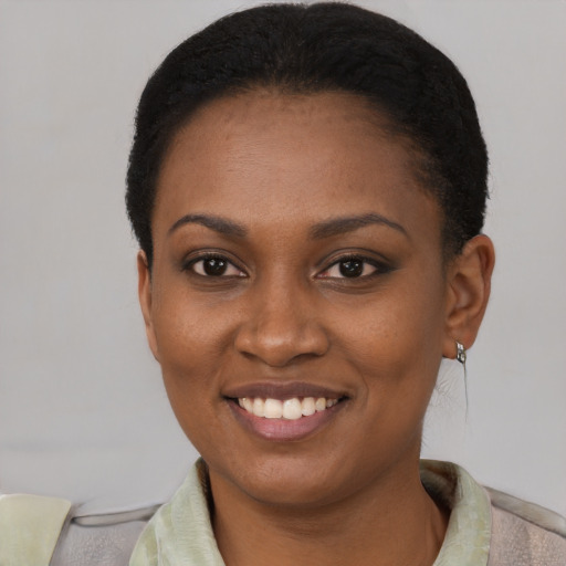 Joyful latino young-adult female with short  black hair and brown eyes