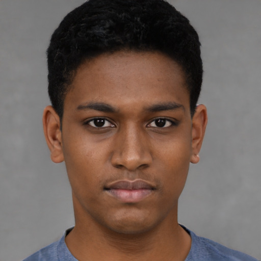 Neutral black young-adult male with short  black hair and brown eyes