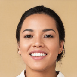 Joyful white young-adult female with long  black hair and brown eyes