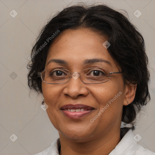 Joyful latino adult female with medium  brown hair and brown eyes