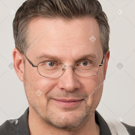 Joyful white adult male with short  brown hair and grey eyes