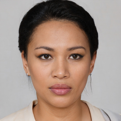 Neutral white young-adult female with short  black hair and brown eyes