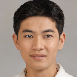 Joyful asian young-adult male with short  brown hair and brown eyes