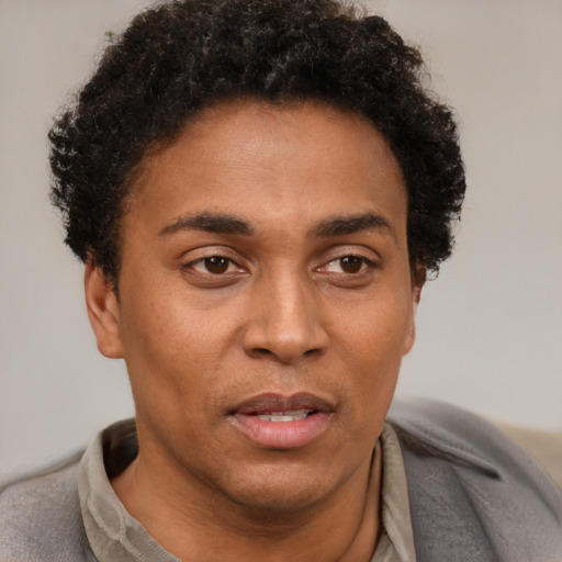 Neutral black adult male with short  brown hair and brown eyes