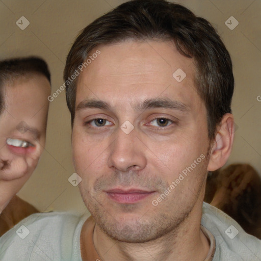 Joyful white adult male with short  brown hair and brown eyes