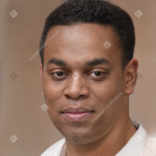 Joyful latino young-adult male with short  brown hair and brown eyes