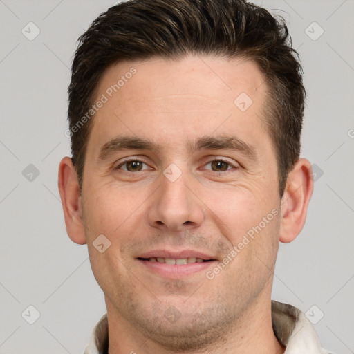 Joyful white adult male with short  brown hair and brown eyes