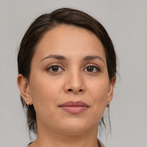 Joyful white young-adult female with medium  brown hair and brown eyes