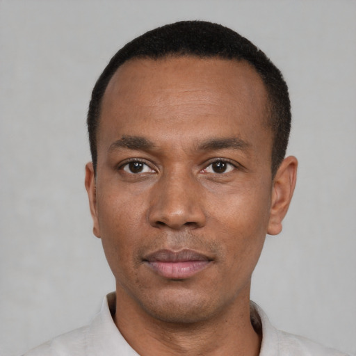 Neutral black young-adult male with short  black hair and brown eyes