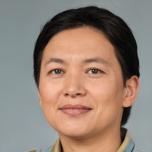 Joyful white adult female with medium  brown hair and brown eyes