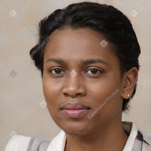 Joyful black young-adult female with short  brown hair and brown eyes