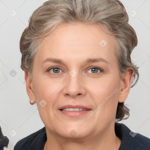 Joyful white adult female with medium  brown hair and grey eyes