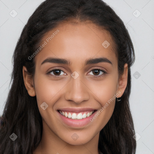 Joyful latino young-adult female with long  brown hair and brown eyes