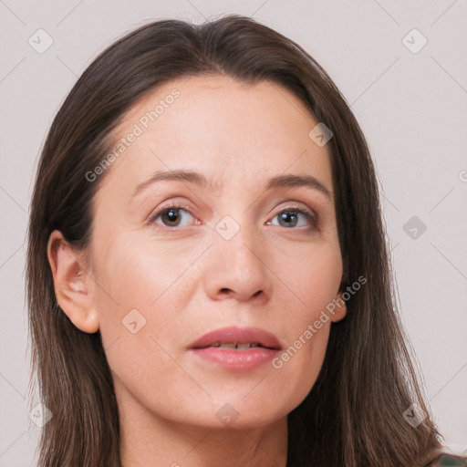 Joyful white adult female with long  brown hair and brown eyes