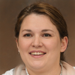 Joyful white adult female with medium  brown hair and brown eyes