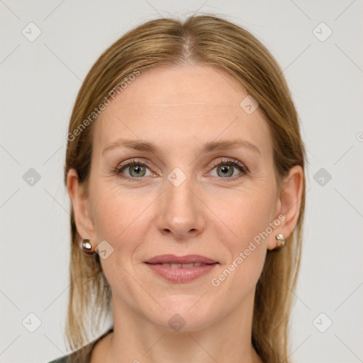 Joyful white adult female with medium  brown hair and grey eyes