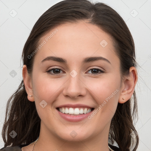 Joyful white young-adult female with long  brown hair and grey eyes