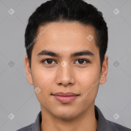 Joyful latino young-adult male with short  black hair and brown eyes