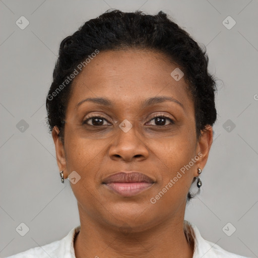 Joyful black adult female with short  brown hair and brown eyes