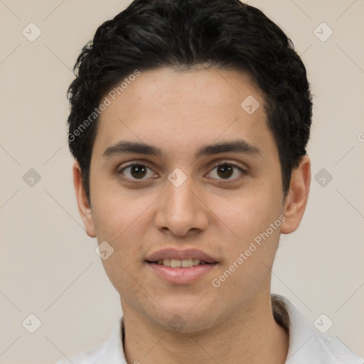 Joyful white young-adult male with short  black hair and brown eyes