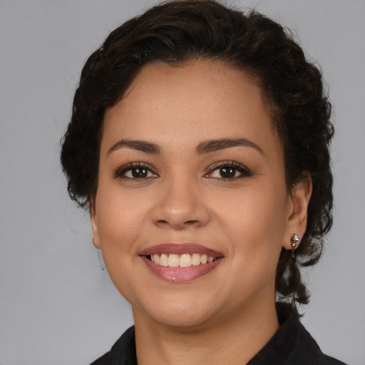Joyful white young-adult female with medium  brown hair and brown eyes