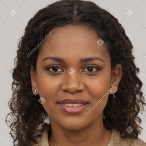 Joyful black young-adult female with long  brown hair and brown eyes