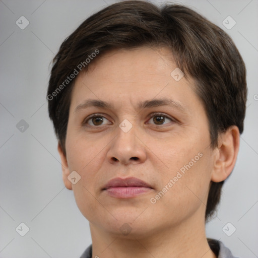 Joyful white adult female with short  brown hair and brown eyes