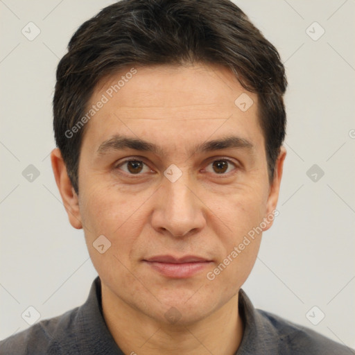 Joyful white adult male with short  brown hair and brown eyes