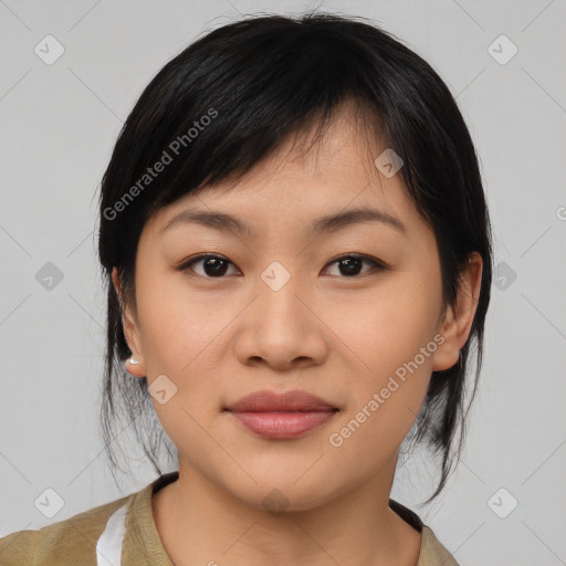 Joyful asian young-adult female with medium  black hair and brown eyes