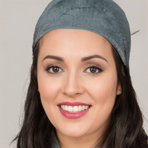 Joyful white young-adult female with long  black hair and brown eyes