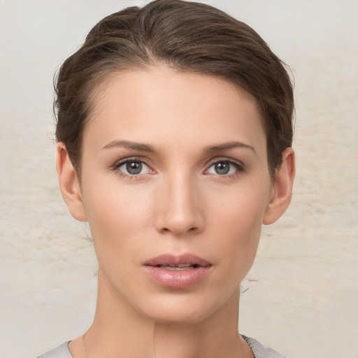 Neutral white young-adult female with short  brown hair and brown eyes